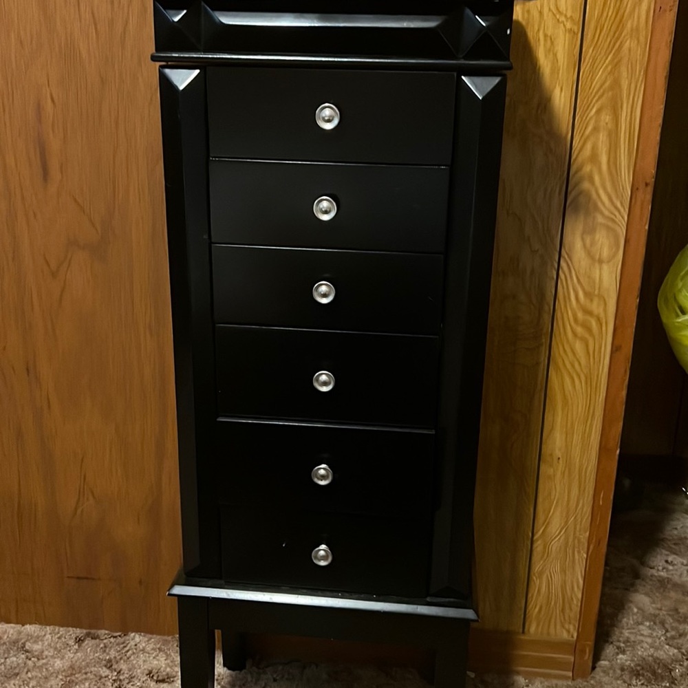 Jewelry box , has seven slots plus two side doors.